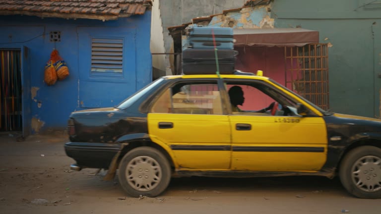Away luggage on the roof of a Dakar taxi