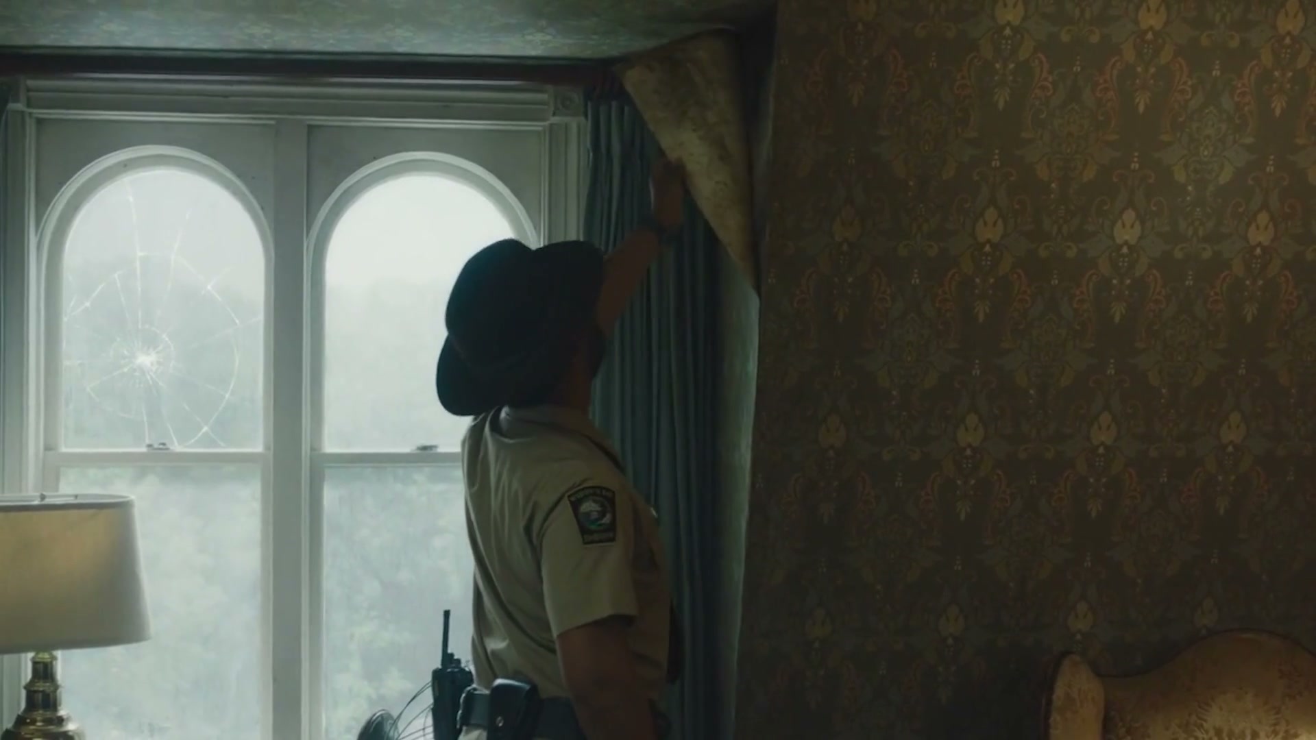 A sheriff in a dim room in Widow’s Bay